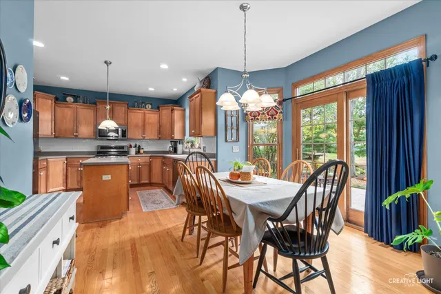 a kitchen with stainless steel appliances granite countertop a sink a stove top oven a counter space and cabinets