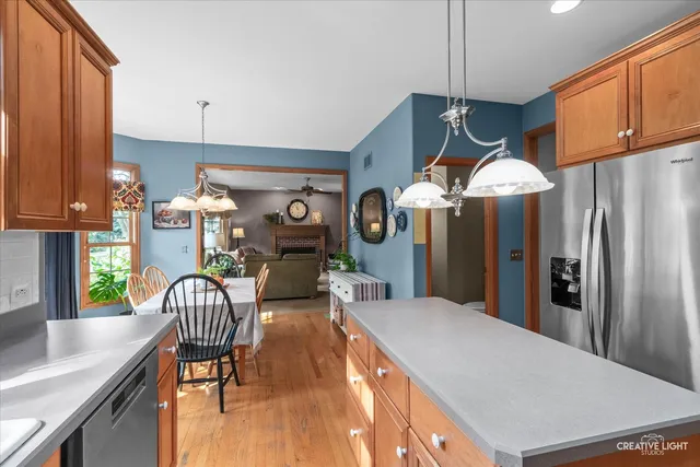 a kitchen with stainless steel appliances a refrigerator sink and stove