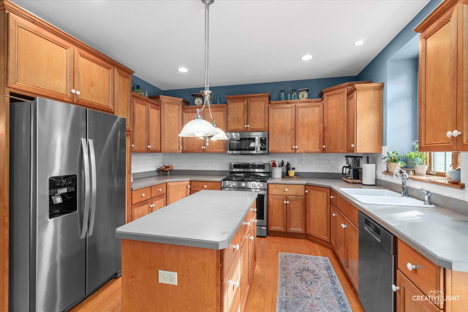 611 Pine Street Sugar Grove, IL 60554 - Photo 15 of 61 a kitchen with stainless steel appliances a refrigerator sink and stove