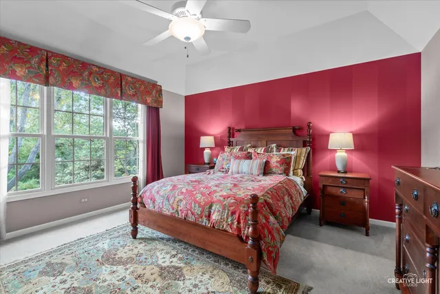 a bedroom with a bed and a dresser in it