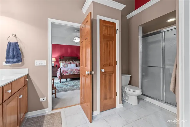 a spacious bathroom with a granite countertop sink mirror and a bathtub