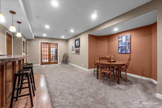 a front view of residential houses with yard and green space