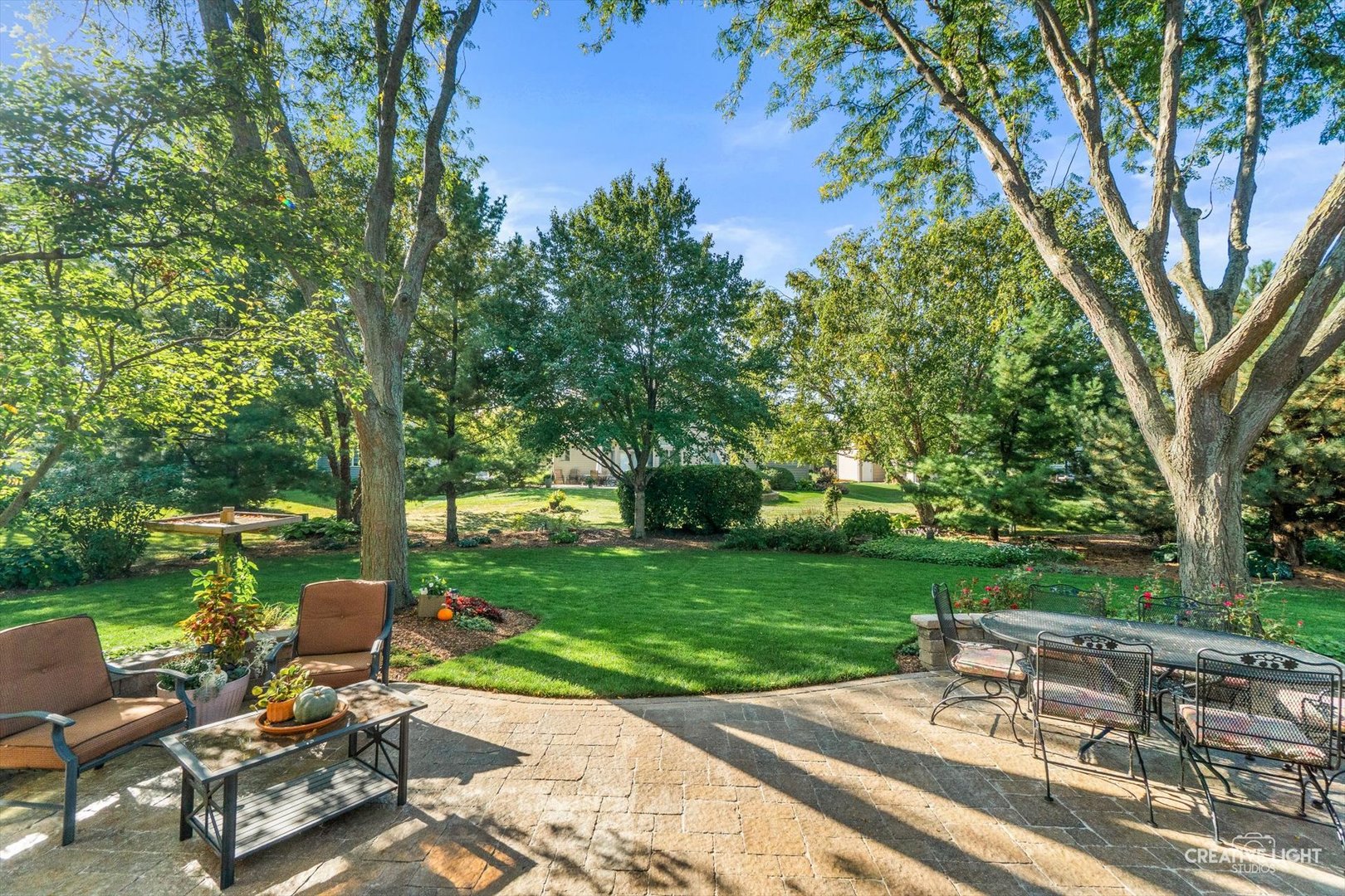 611 Pine Street Sugar Grove, IL 60554 - Photo 43 of 61 a view of a patio with a table chairs and a fire pit