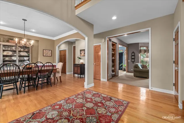 a living room with furniture a fireplace and a large window