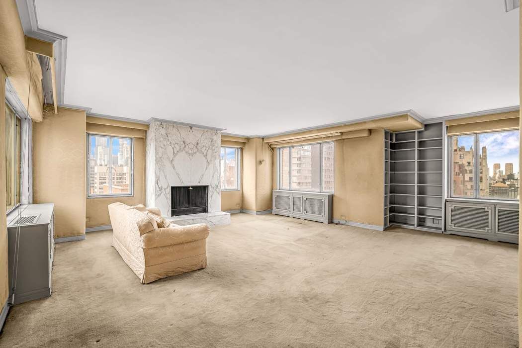 140 East 72nd Street, Unit PH Manhattan, NY 10021 - Photo 11 of 12 a view of livingroom with furniture fireplace and window