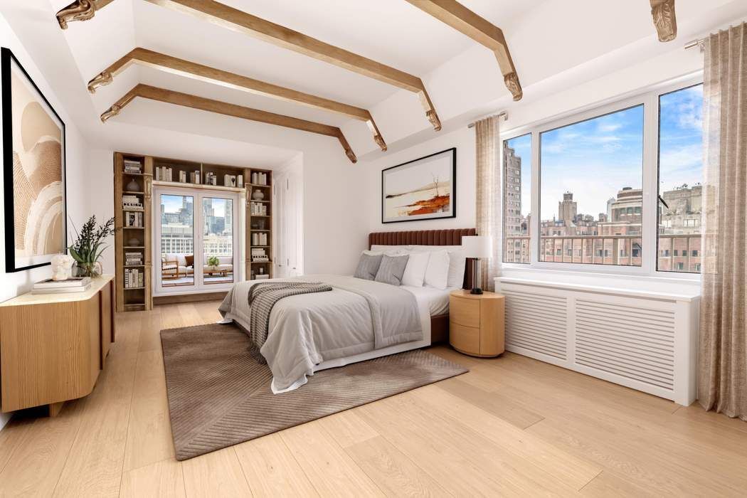 140 East 72nd Street, Unit PH Manhattan, NY 10021 - Photo 4 of 12 a bed room with a bed and a large window