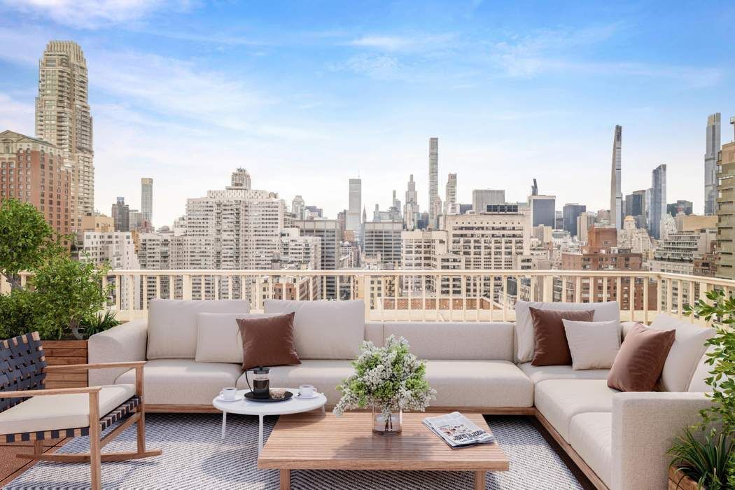 140 East 72nd Street, Unit PH Manhattan, NY 10021 - Photo 6 of 12 a balcony with furniture and a potted plant