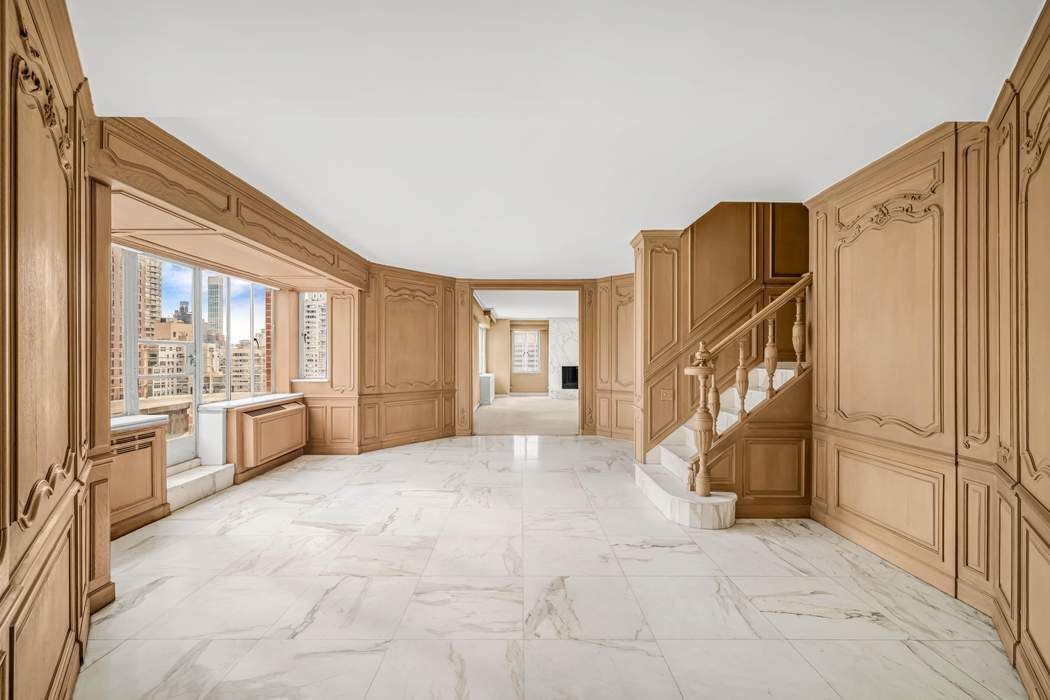140 East 72nd Street, Unit PH Manhattan, NY 10021 - Photo 7 of 12 a view of an entryway with staircase
