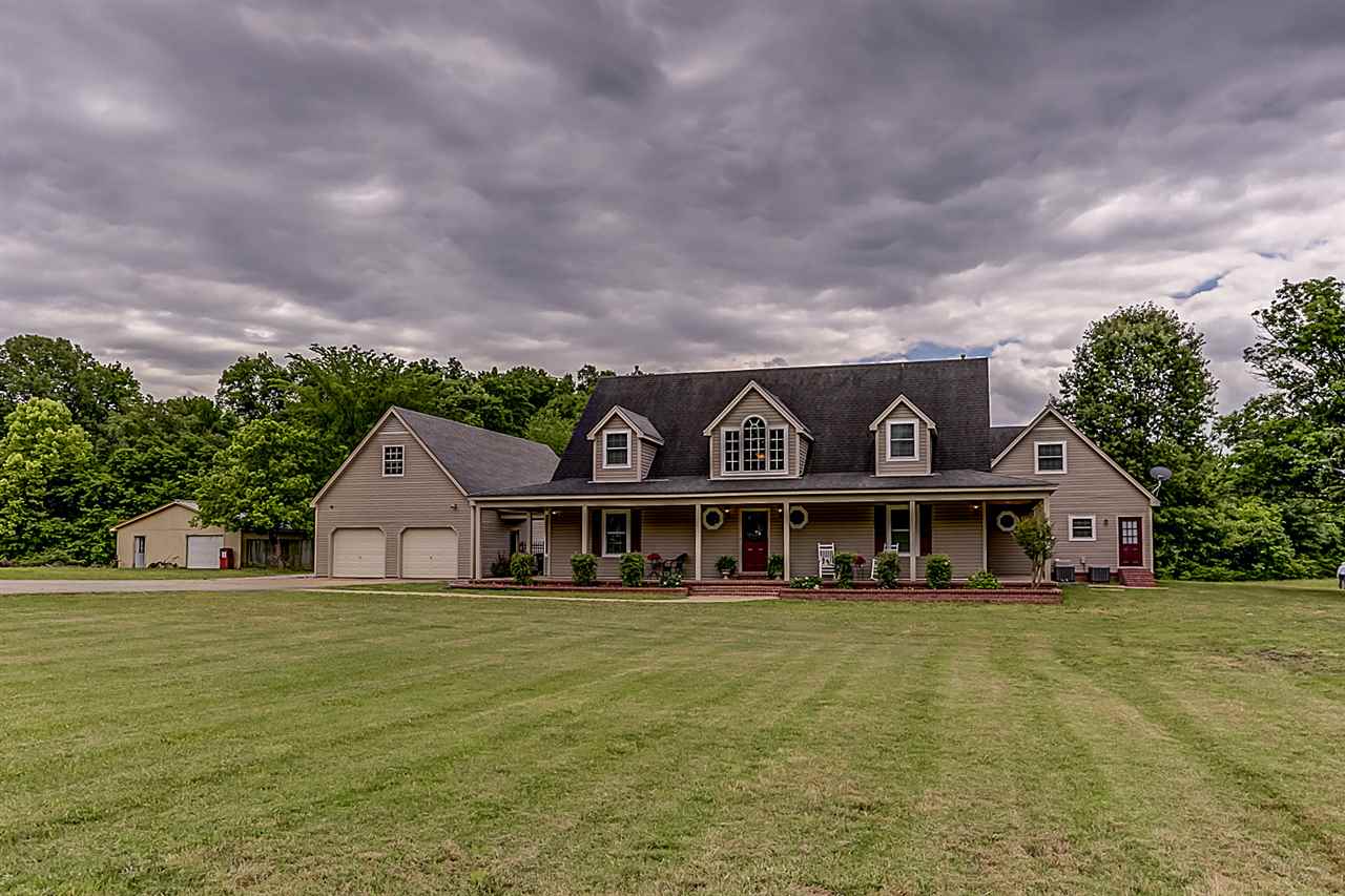 9465 Pleasant Ridge Road Lakeland, TN 38002 - Photo 1 of 18 RARE find in LAKELAND! 4,000 sq ft of "Southern Charm living" with a full wrap around porch! This home has a FULL in-law suite, 8 car garage and quietly sits on 4.8 acres of land!!