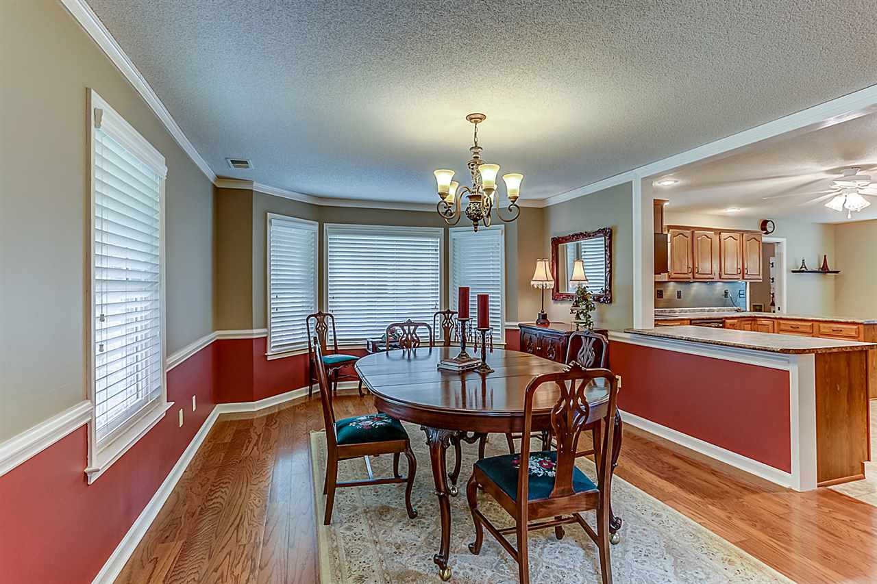 9465 Pleasant Ridge Road Lakeland, TN 38002 - Photo 5 of 18 Large Dining Room with a bay window , hard wood flooring and 2 inch blinds.