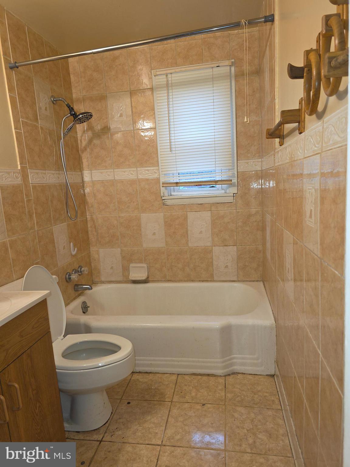 1212 Kevin Road Baltimore, MD 21229 - Photo 9 of 9 a bathroom with a toilet and a shower
