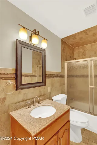 a view of a big room with closet and chandelier fan