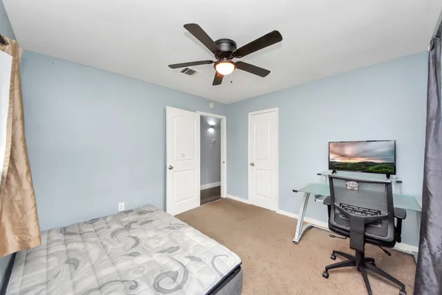 a work room with furniture and windows