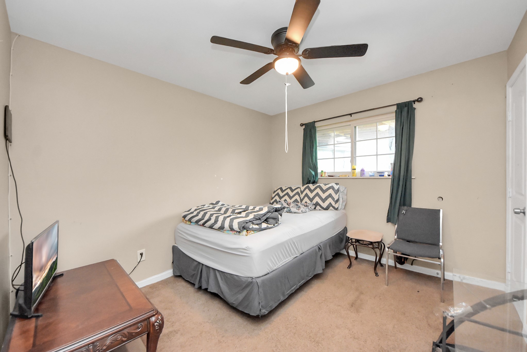 2443 Lauder Road Houston, TX 77039 - Photo 17 of 21 a living room with furniture and a window