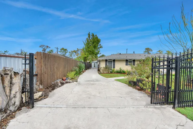 a view of a house with a yard and plants