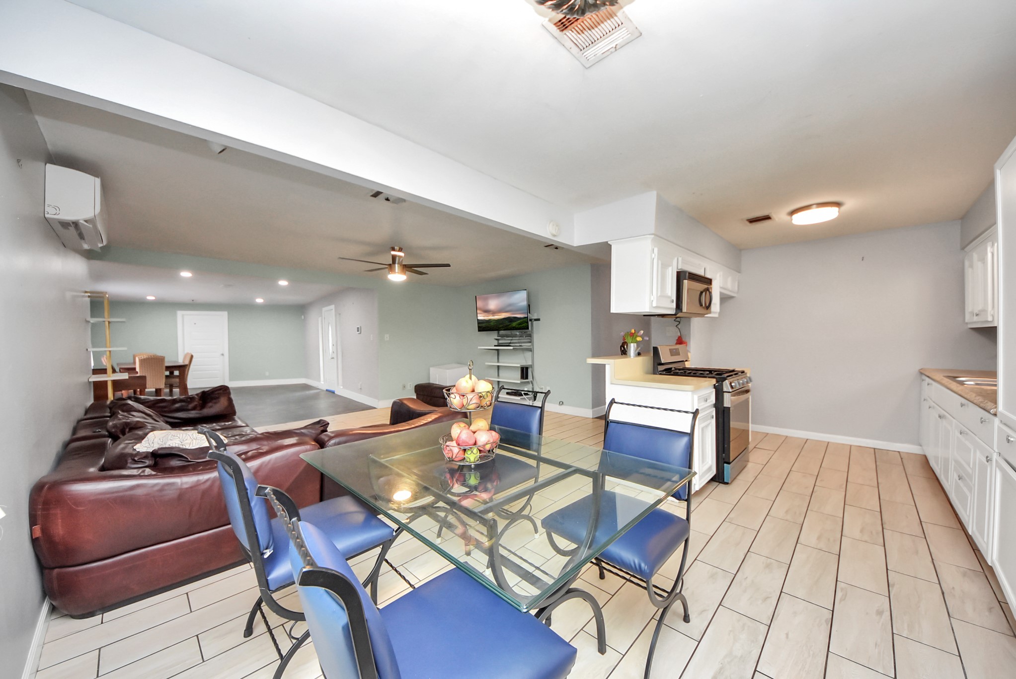 2443 Lauder Road Houston, TX 77039 - Photo 7 of 21 a living room with furniture a rug and white walls