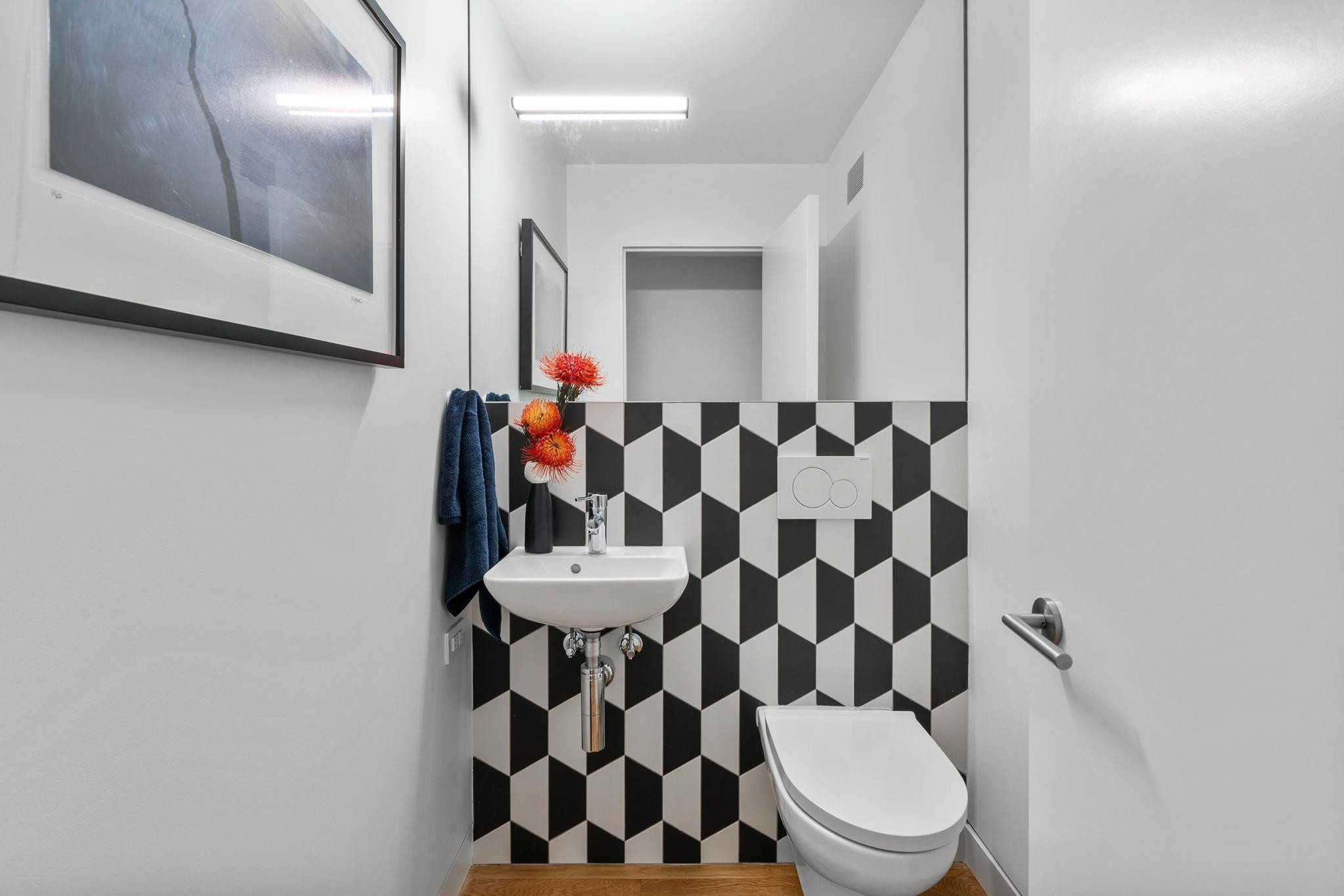 920 Tower Street Raleigh, NC 27607 - Photo 12 of 54 a bathroom with a toilet and a shower curtain