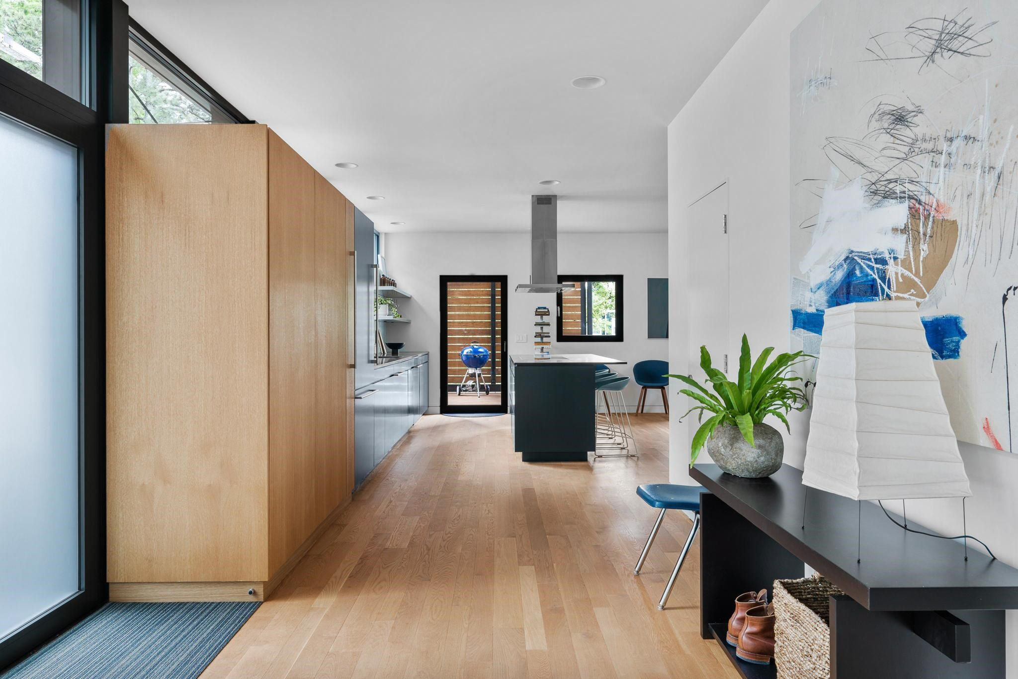 920 Tower Street Raleigh, NC 27607 - Photo 13 of 54 a living room with furniture potted plant and a flat screen tv