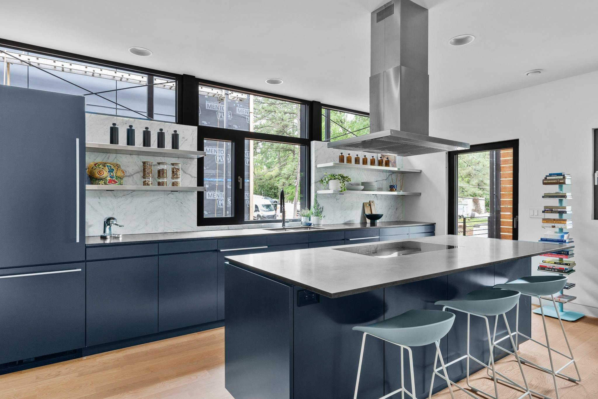 920 Tower Street Raleigh, NC 27607 - Photo 14 of 54 a kitchen with stainless steel appliances granite countertop a sink and a stove