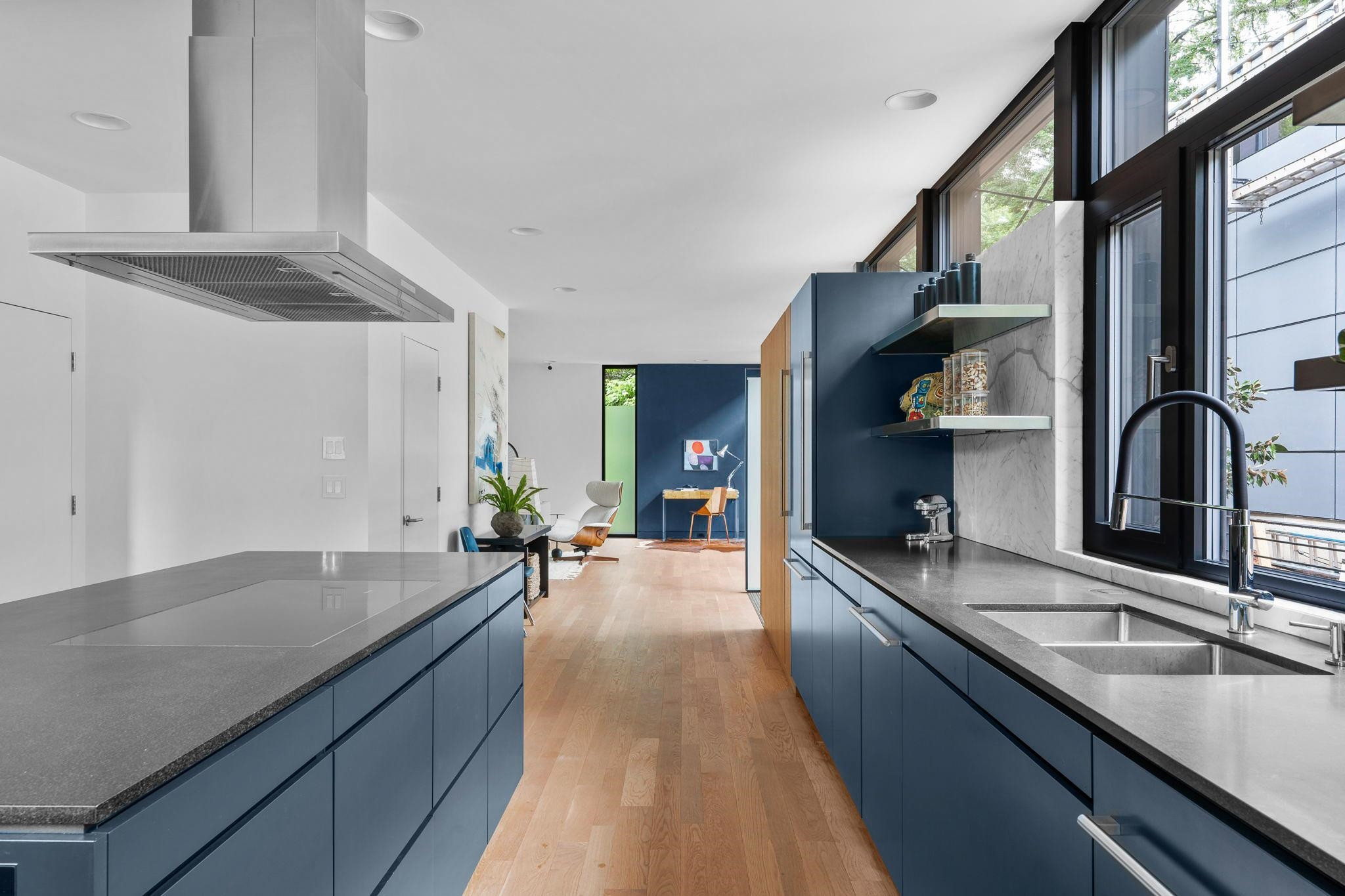 920 Tower Street Raleigh, NC 27607 - Photo 16 of 54 a large kitchen with granite countertop a sink and a stove top oven