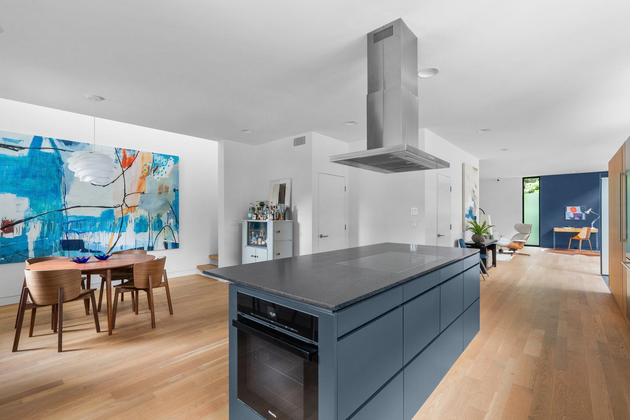 920 Tower Street Raleigh, NC 27607 - Photo 17 of 54 a living room with a table and chairs