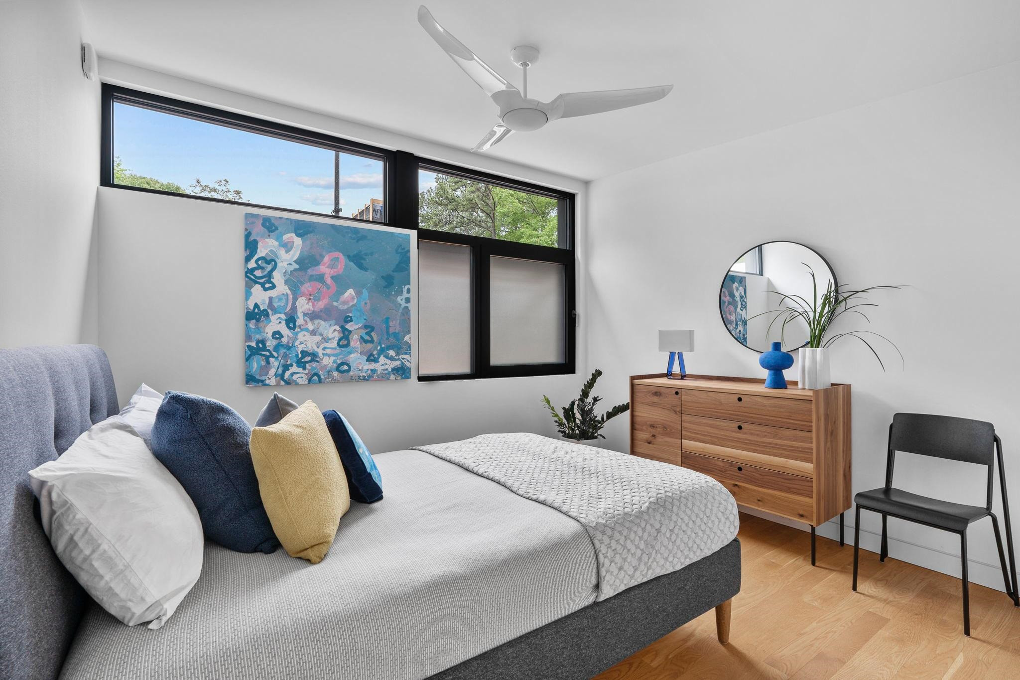 920 Tower Street Raleigh, NC 27607 - Photo 26 of 54 a bedroom with a bed and a chandelier