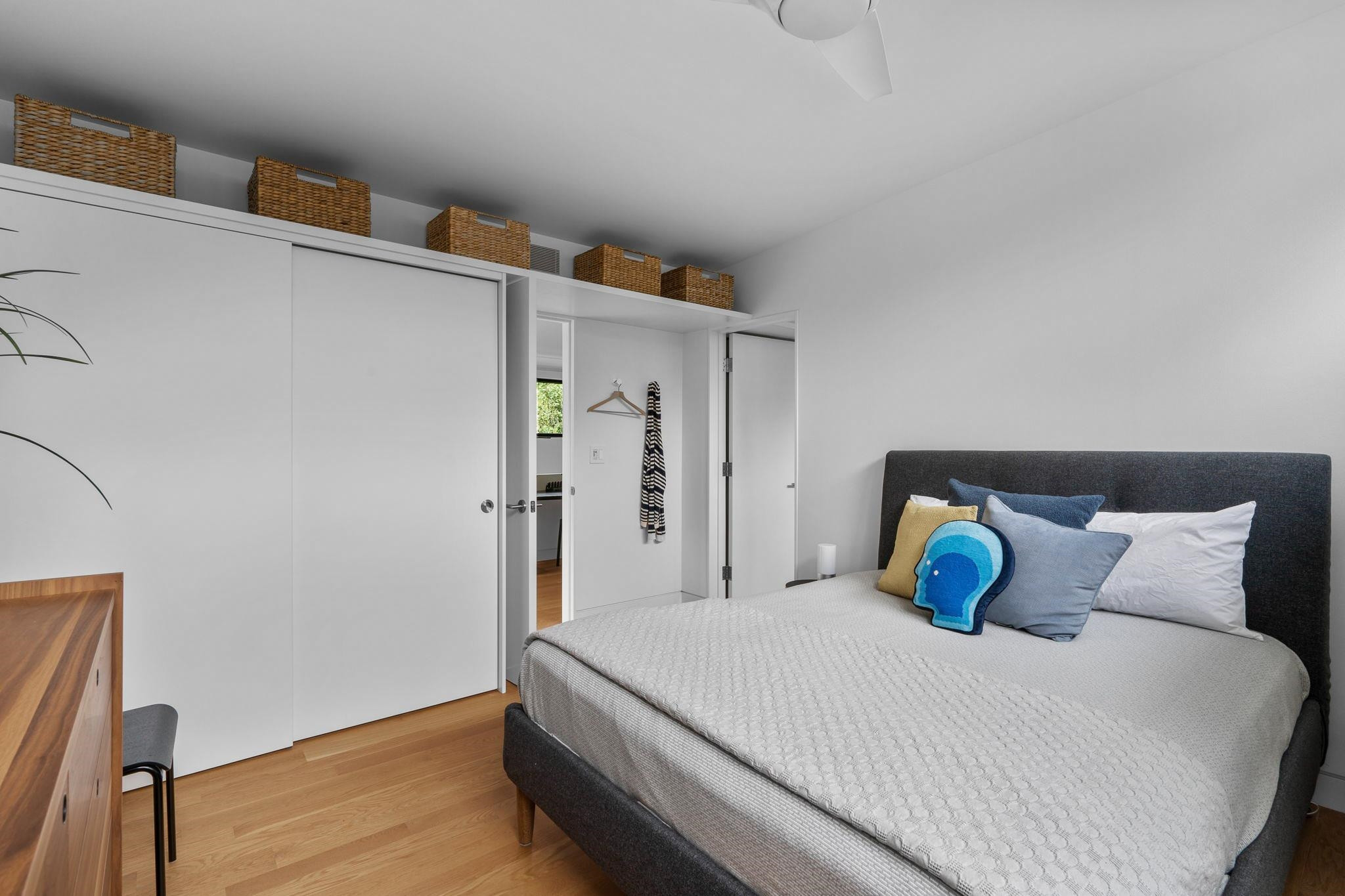 920 Tower Street Raleigh, NC 27607 - Photo 27 of 54 a bedroom with a bed and wooden floor