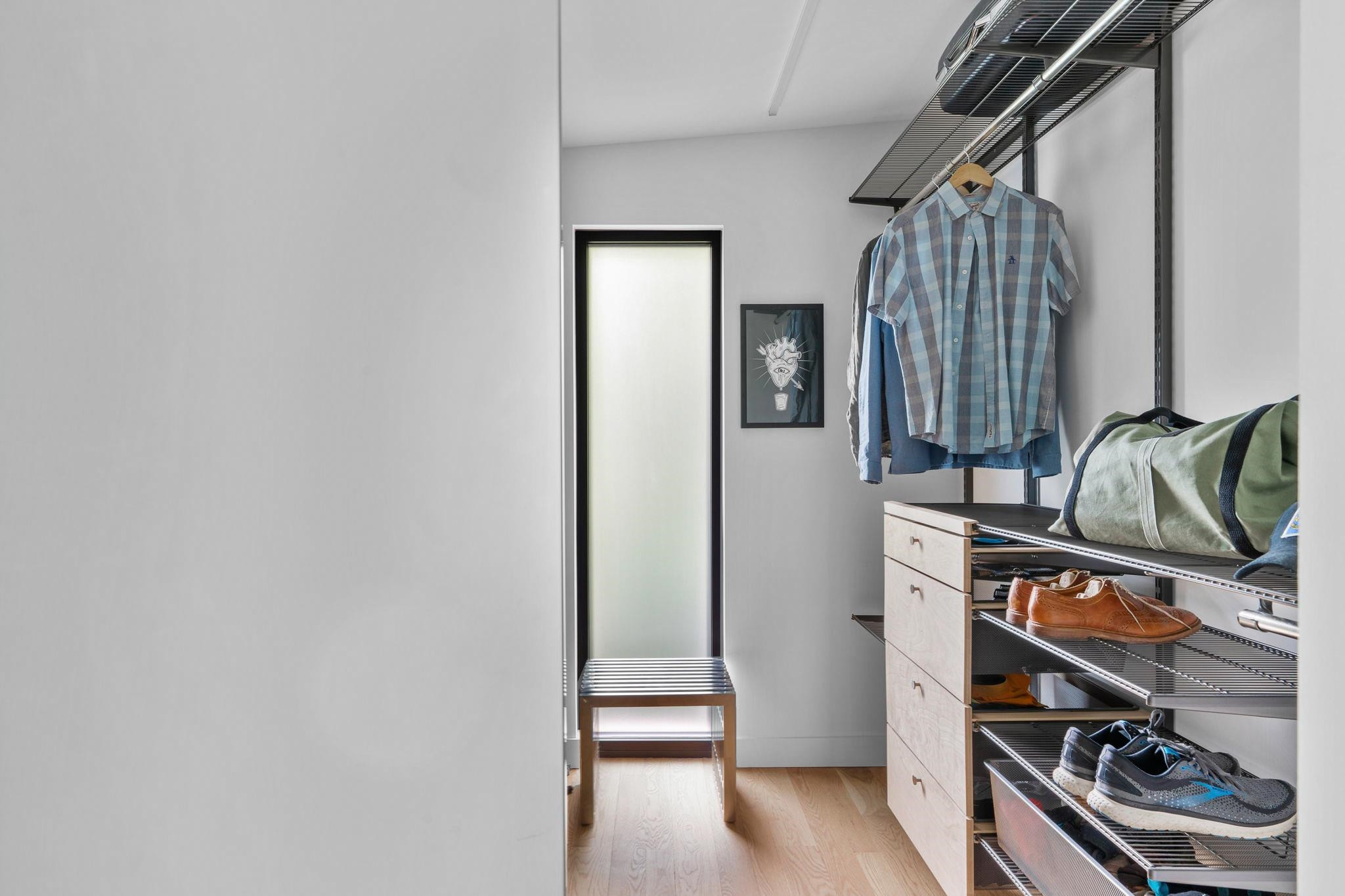 920 Tower Street Raleigh, NC 27607 - Photo 34 of 54 a view of walk in closet with clothes and shoes