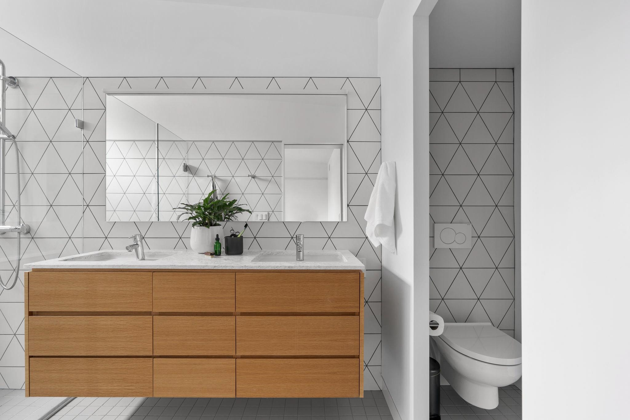 920 Tower Street Raleigh, NC 27607 - Photo 38 of 54 a bathroom with a sink a toilet and mirror