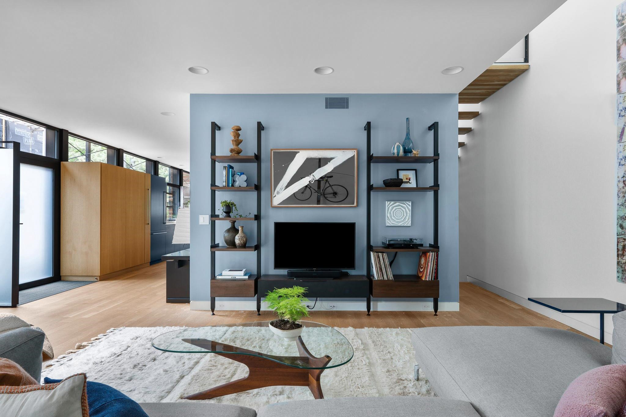 920 Tower Street Raleigh, NC 27607 - Photo 8 of 54 a living room with furniture and a flat screen tv