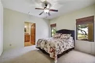 a bedroom with a bed and a table