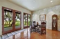 a view of a hallway and a livingroom with furniture
