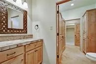 a bathroom with a sink vanity and a mirror