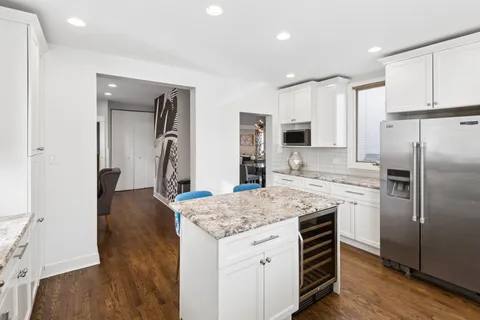 a view of a livingroom with furniture and wooden floor