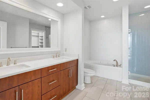 a bathroom with a sink a toilet and a bathtub