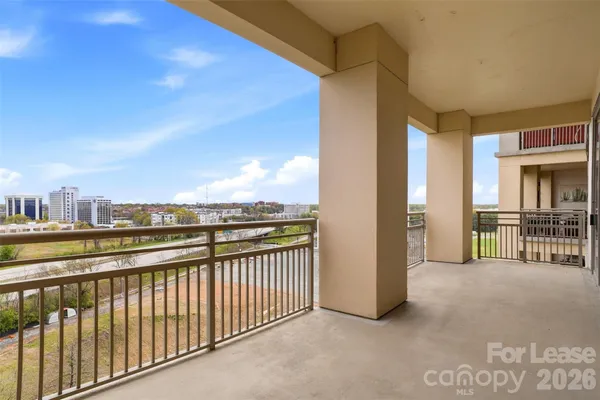 a view of a balcony with city