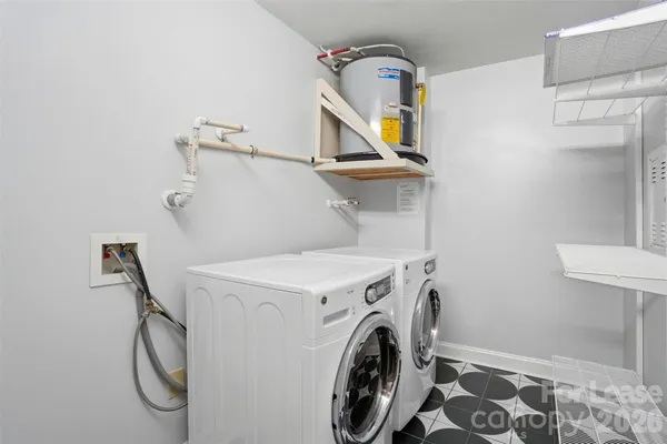 a lobby with furniture and potted plants
