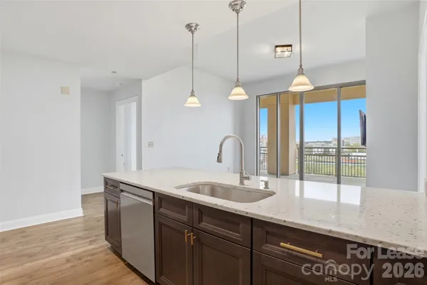 a kitchen with a sink and window