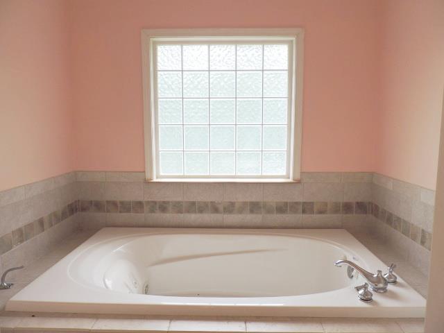 956 Gratton Road Clarksville, TN 37043 - Photo 9 of 16 Master bath with separate Whirlpool tub and tile shower.
