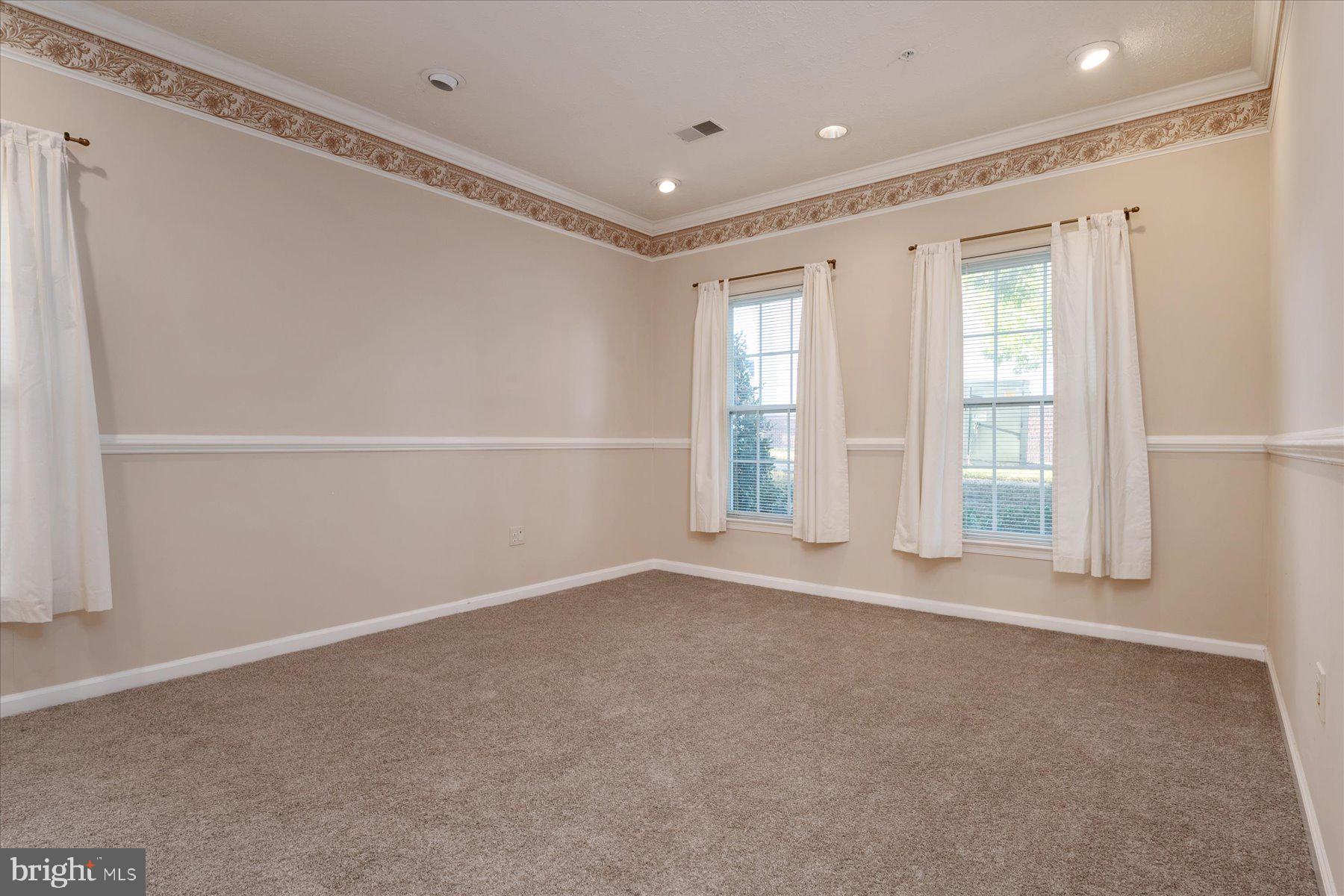2502 Amber Orchard Court West, Unit 104 Odenton, MD 21113 - Photo 14 of 28 a view of an empty room with a window