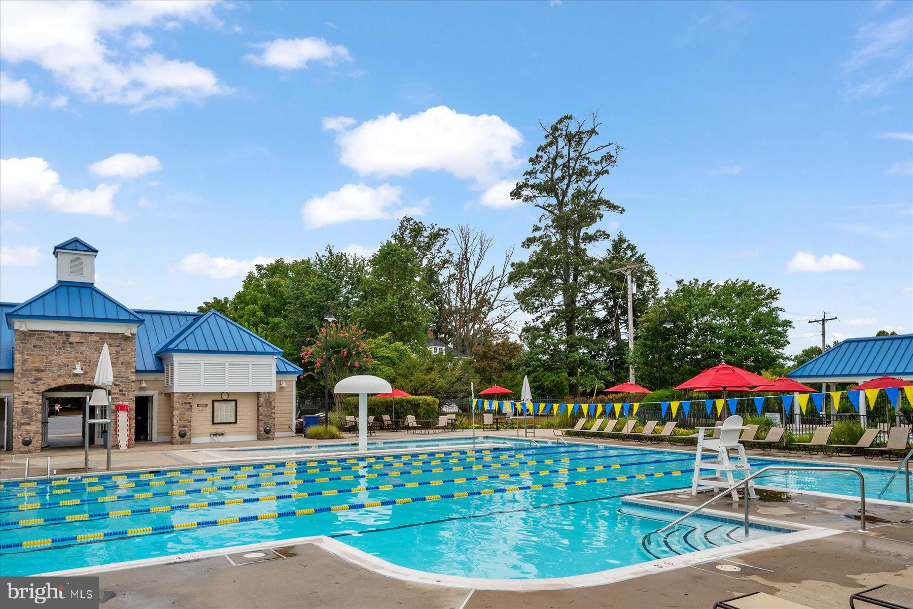 2502 Amber Orchard Court West, Unit 104 Odenton, MD 21113 - Photo 21 of 28 a front view of a house with garden