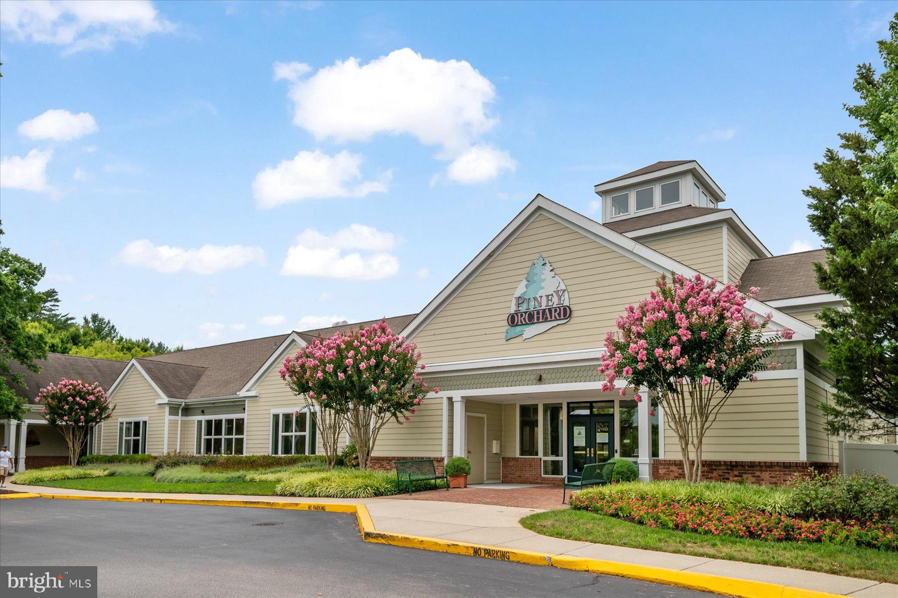 2502 Amber Orchard Court West, Unit 104 Odenton, MD 21113 - Photo 28 of 28 a front view of a house with garden