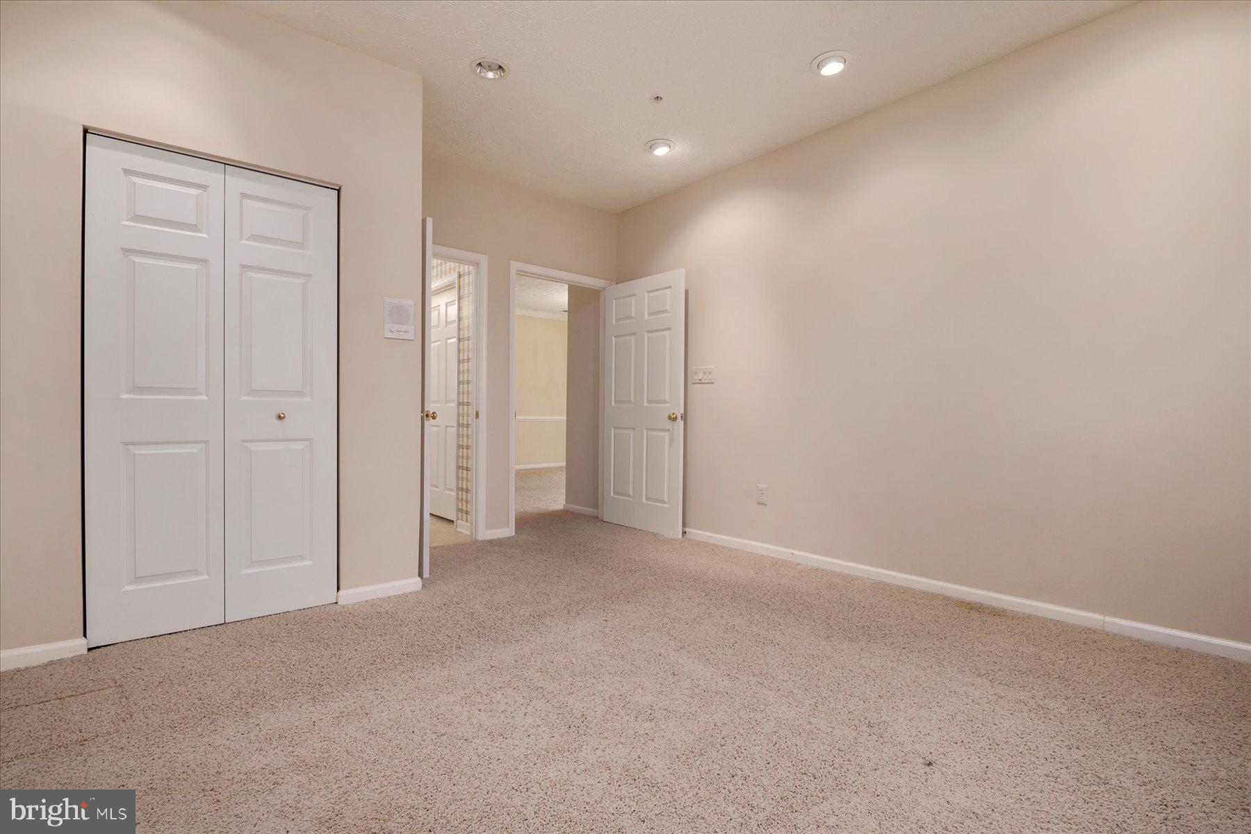 2502 Amber Orchard Court West, Unit 104 Odenton, MD 21113 - Photo 7 of 28 a view of an empty room