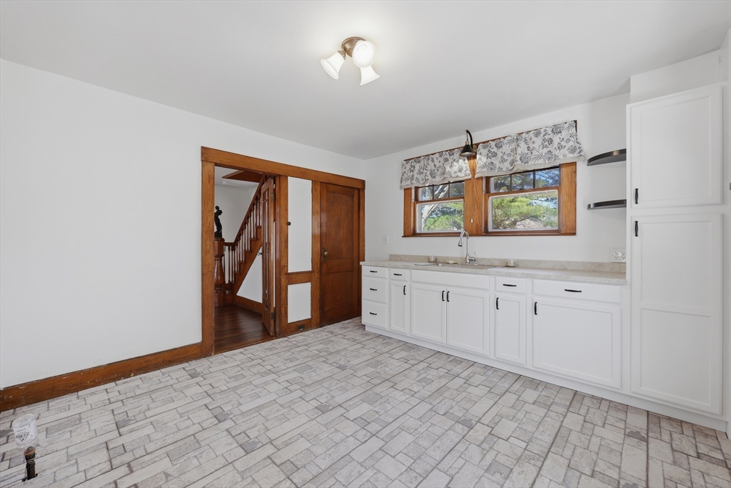 3 Ferry Road Salisbury, MA 01952 - Photo 12 of 35 a view of a kitchen with window cabinet and chandelier