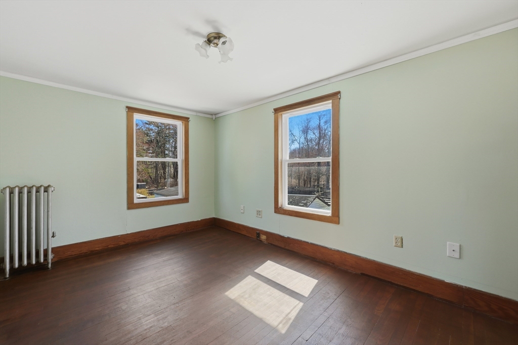 3 Ferry Road Salisbury, MA 01952 - Photo 19 of 35 a view of an empty room with a window and wooden floor