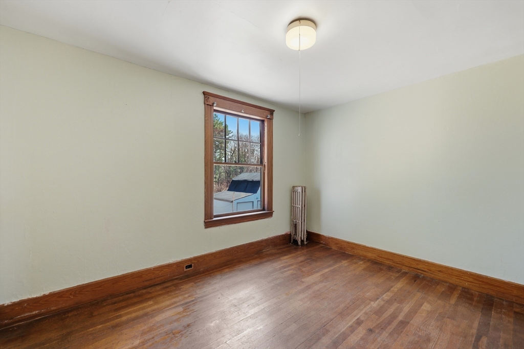 3 Ferry Road Salisbury, MA 01952 - Photo 21 of 35 an empty room with wooden floor and windows
