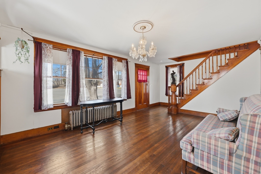 3 Ferry Road Salisbury, MA 01952 - Photo 3 of 35 a view of an entryway with wooden floor and chandelier