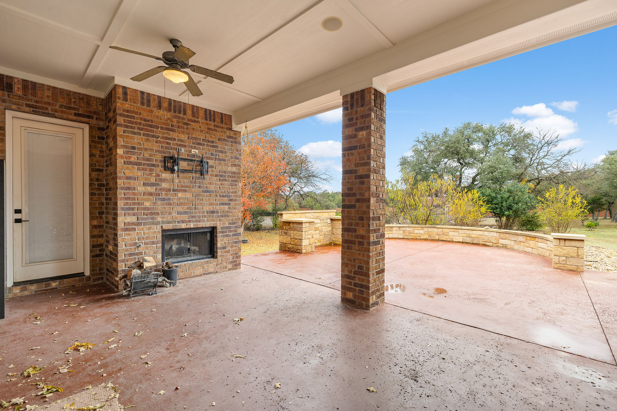 174 Estrella Crossing Georgetown, TX 78628 - Photo 31 of 38 View of patio featuring an outdoor brick fireplace and ceiling fan