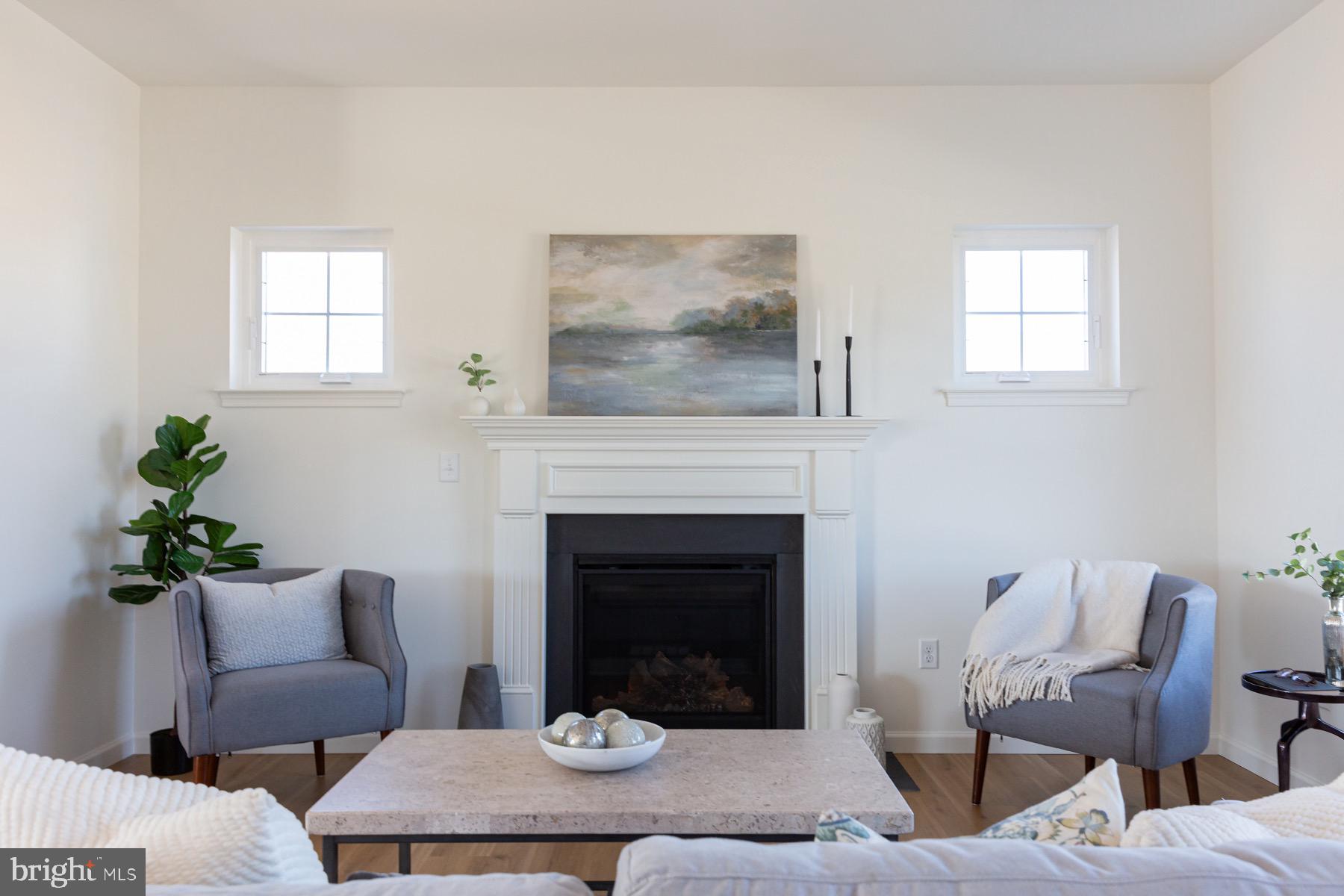 306 Wickmere Street, Unit 68 Oxford, PA 19363 - Photo 11 of 40 a living room with furniture and a fireplace