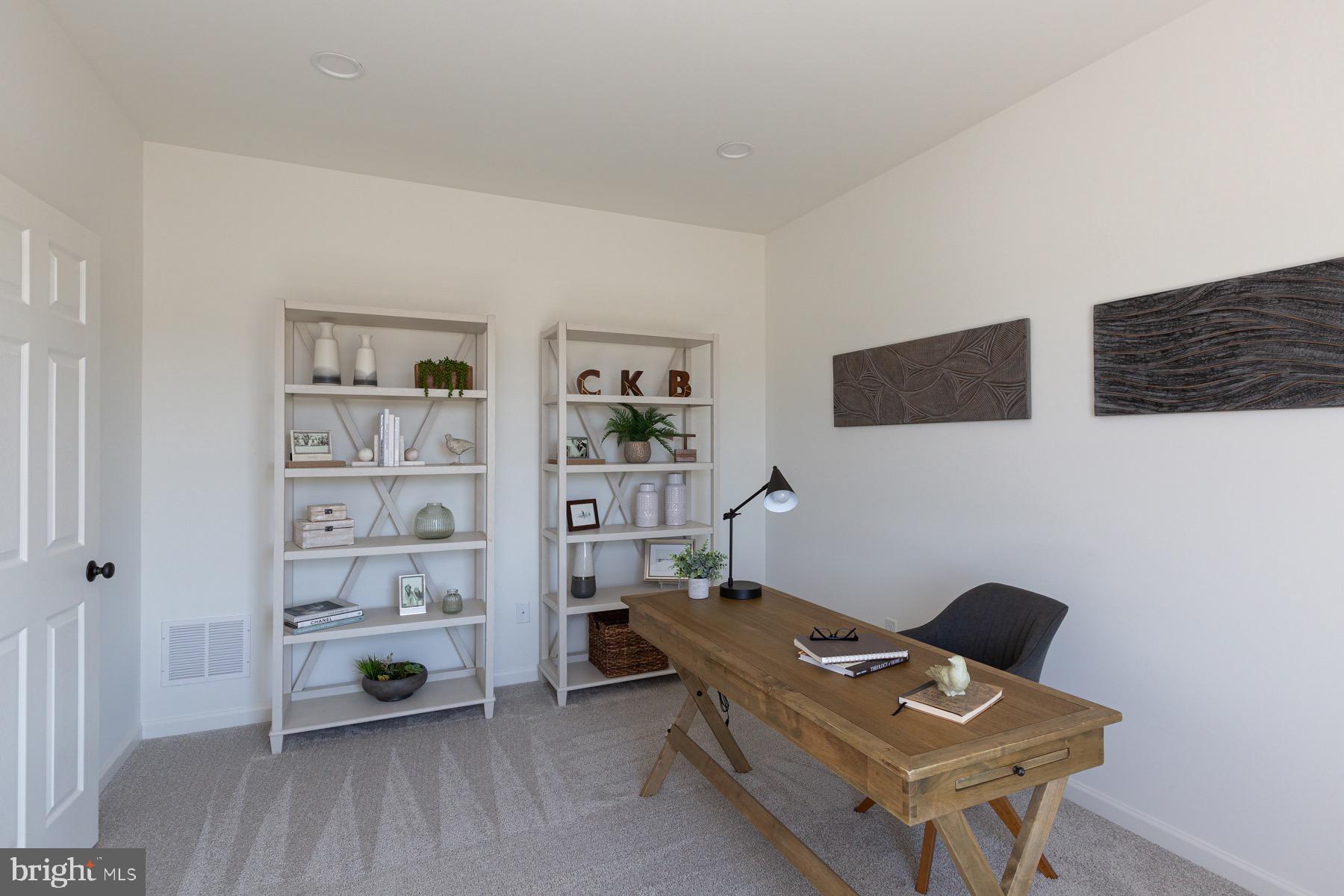 306 Wickmere Street, Unit 68 Oxford, PA 19363 - Photo 15 of 40 a workspace with furniture and lamp